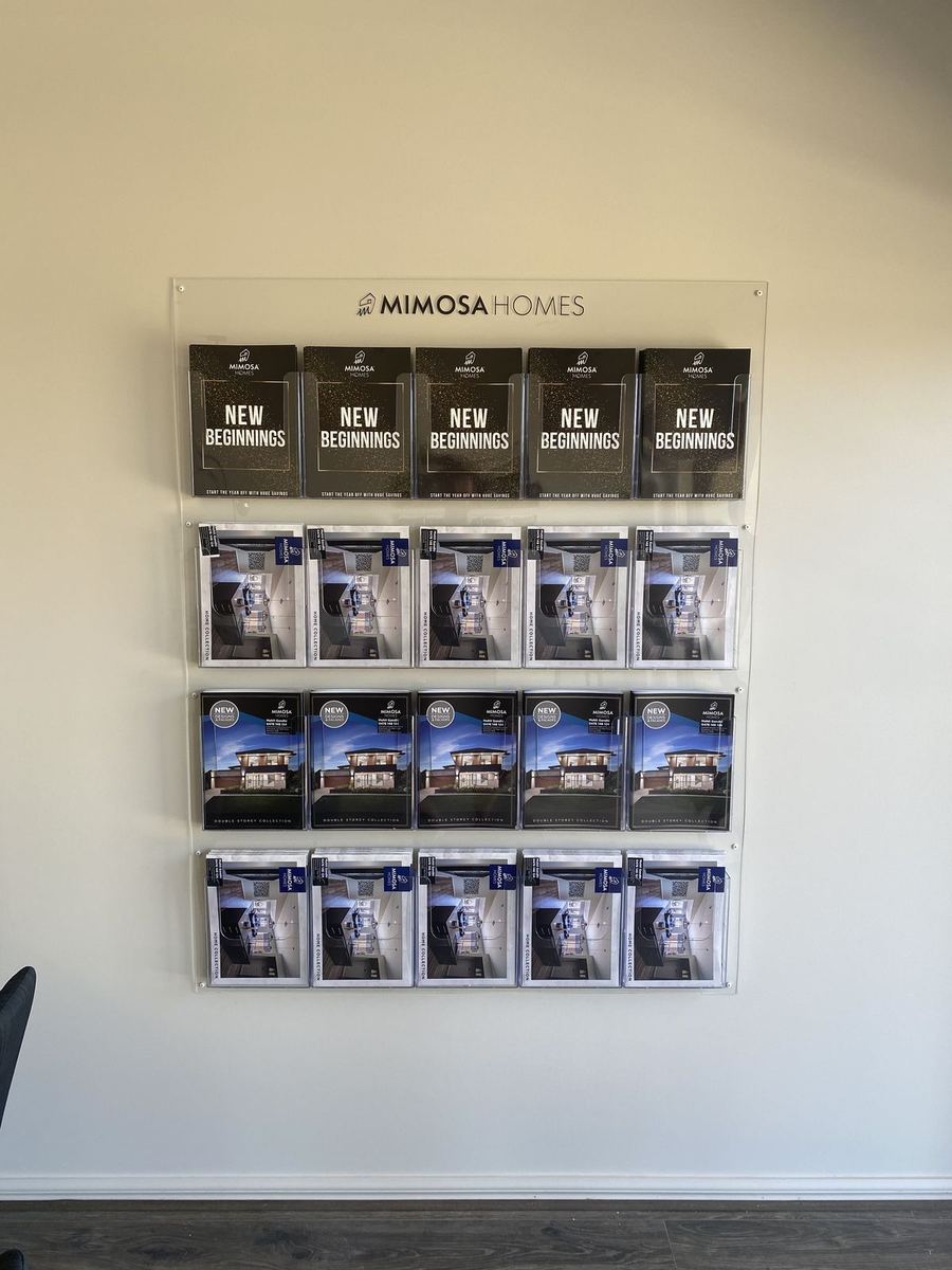 Mimosa Homes wall-mounted acrylic brochure holders