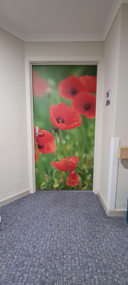 Full-door poppy field vinyl graphic at Royal Freemasons