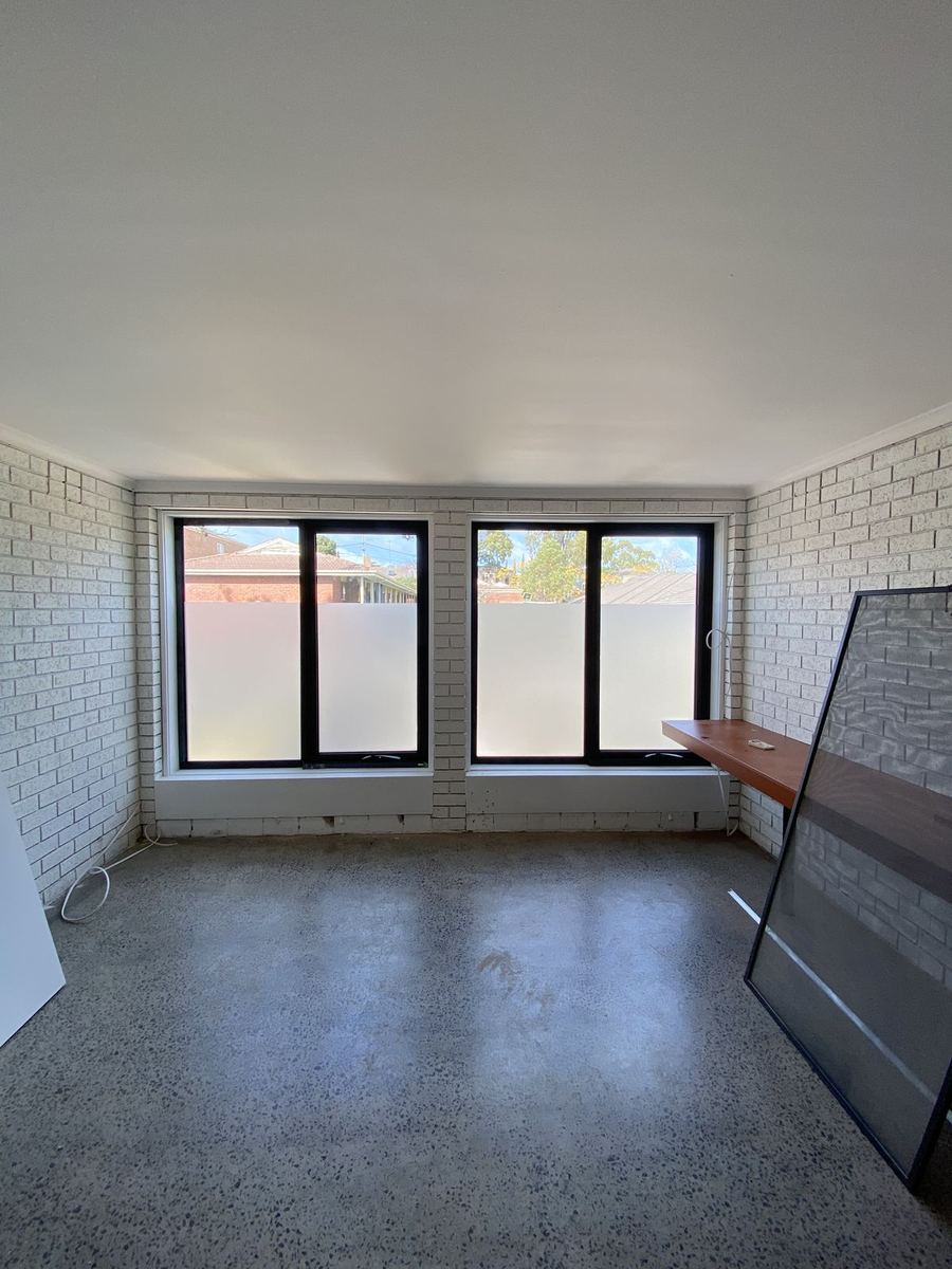 Frosted privacy film on the lower panes of two office windows