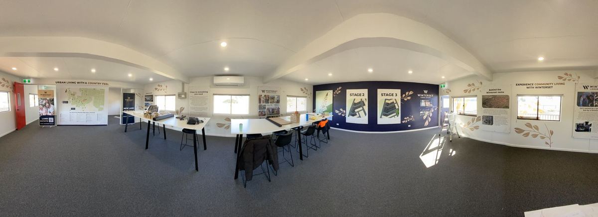 Panoramic view of the Winterset display suite interior and wall signage