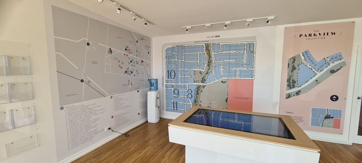 Parkview estate masterplan wall graphics and display table in a sales suite