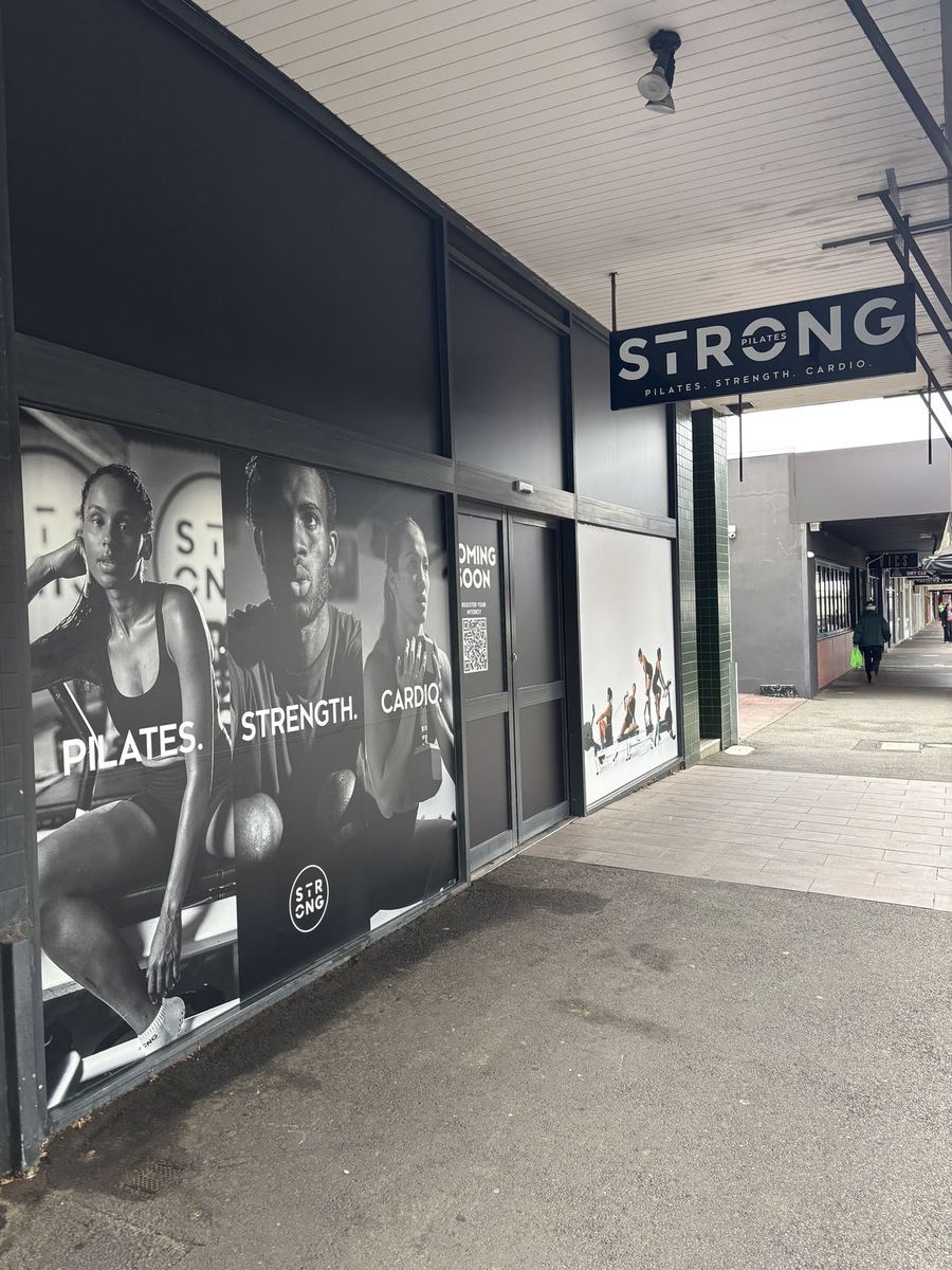 Strong studio external window graphics with athlete imagery