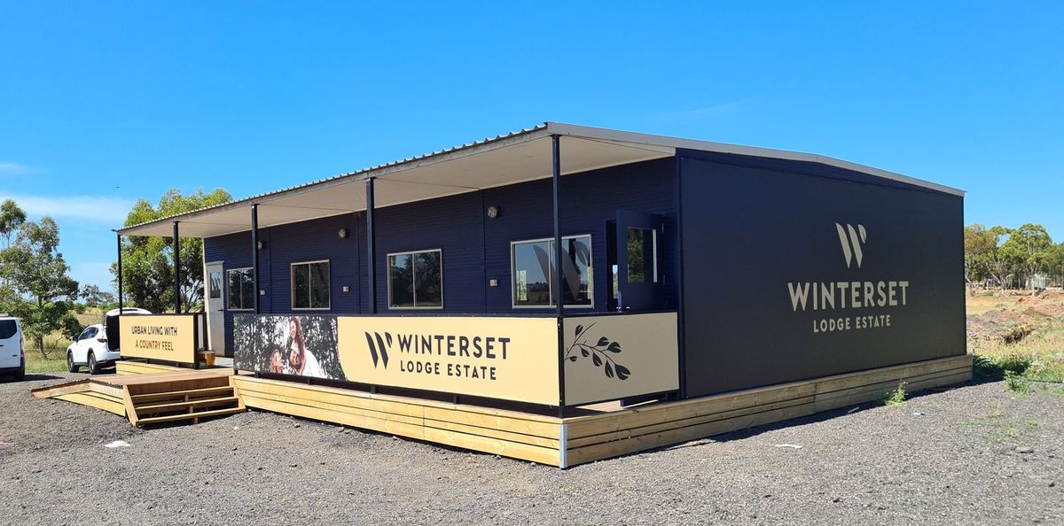 Winterset Lodge Estate branded sales suite exterior, corner view