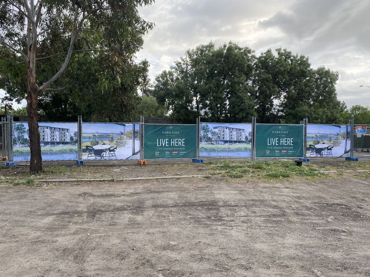 Printed mesh banners on temporary construction fencing