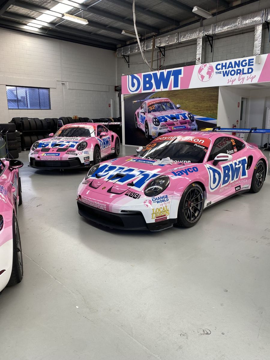Pink BWT motorsport livery wraps on Porsche race cars