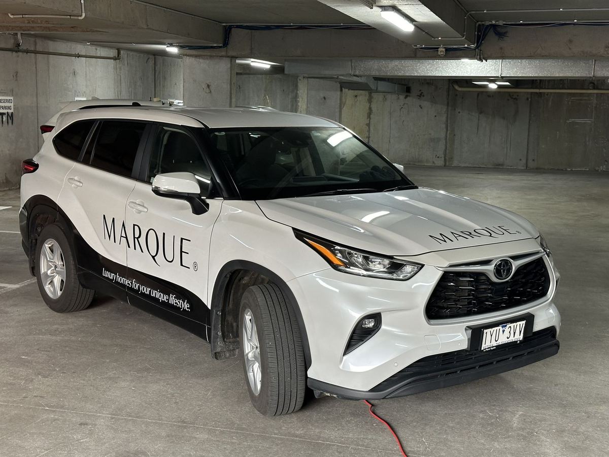 Marque branded SUV with a partial wrap